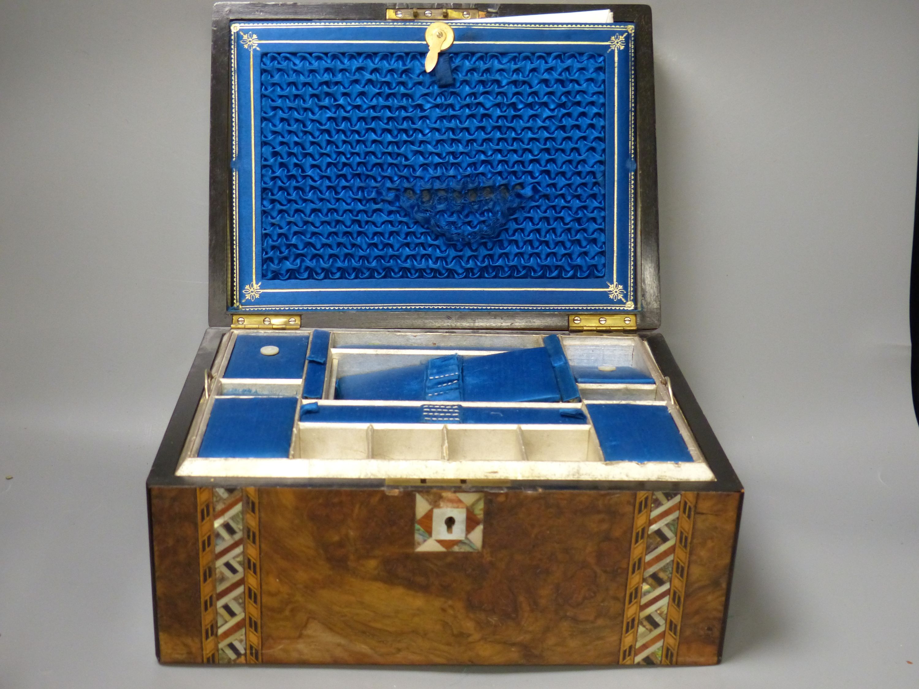A Victorian dome topped brass mounted box and mother of pearl inlaid sewing box lined with blue silk